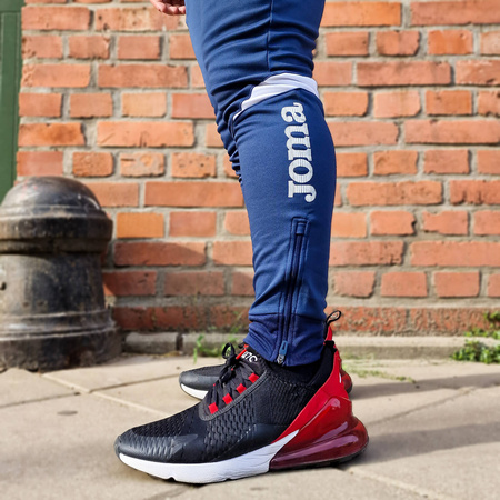 Spodnie Joma Champion VI 102057.332 granatowo-białe spodnie dresowe na co dzień jak i do treningu zapewniające optymalne dopasowanie