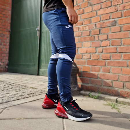 Spodnie Joma Champion VI 102057.332 granatowo-białe spodnie dresowe na co dzień jak i do treningu zapewniające optymalne dopasowanie