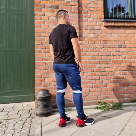 Spodnie Joma Champion VI 102057.332 granatowo-białe spodnie dresowe na co dzień jak i do treningu zapewniające optymalne dopasowanie